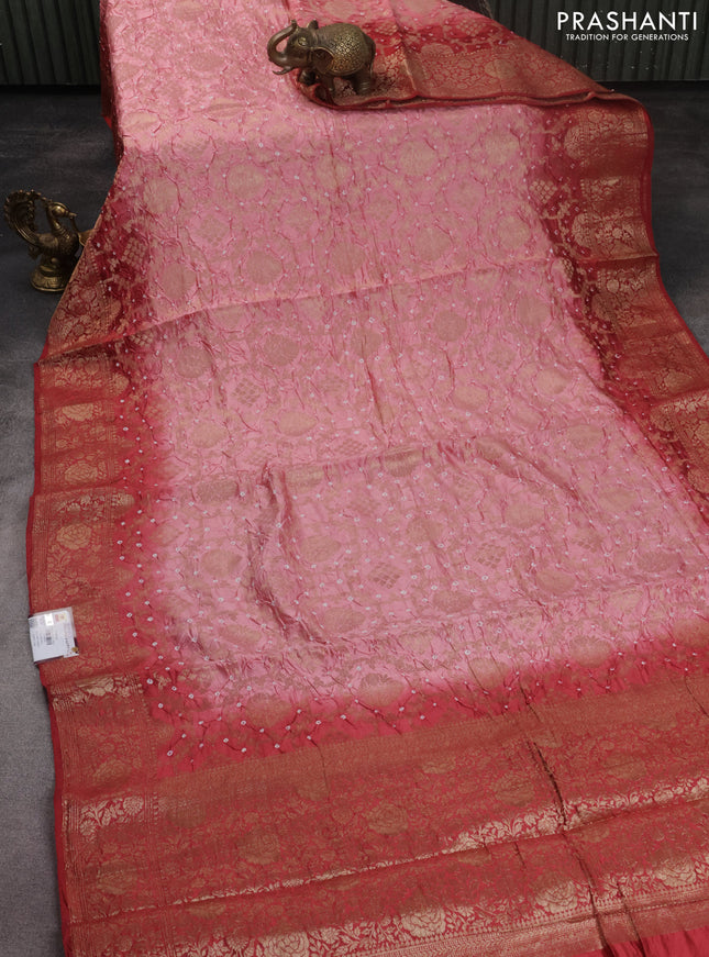Chiniya silk saree peach pink and red shade with allover bandhani prints & zari weaves and zari woven border