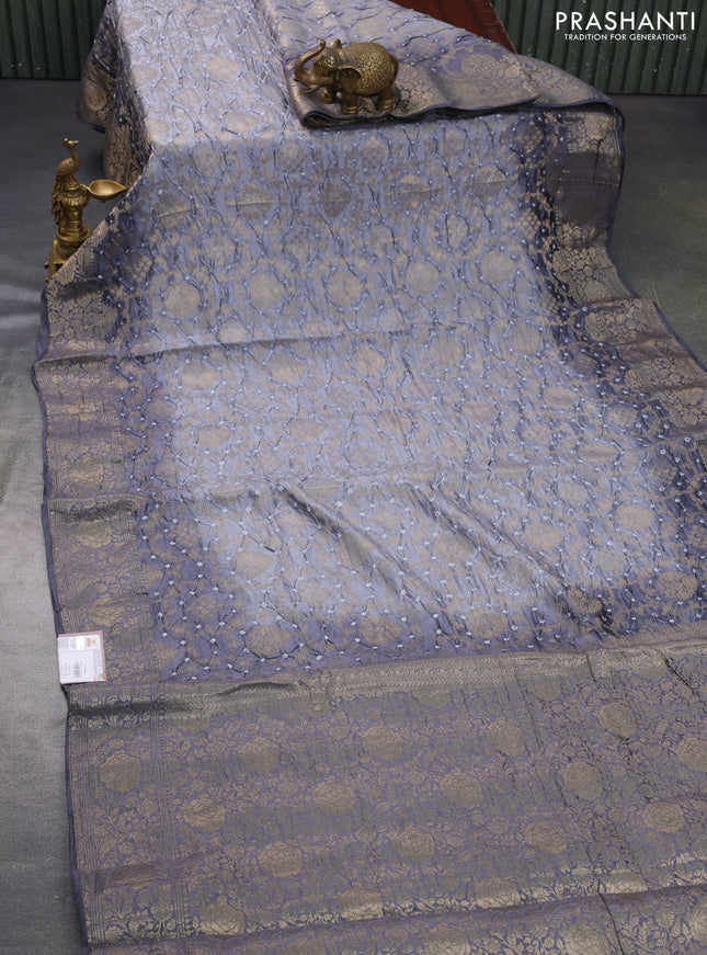 Chiniya silk saree grey with allover bandhani prints & zari weaves and zari woven border
