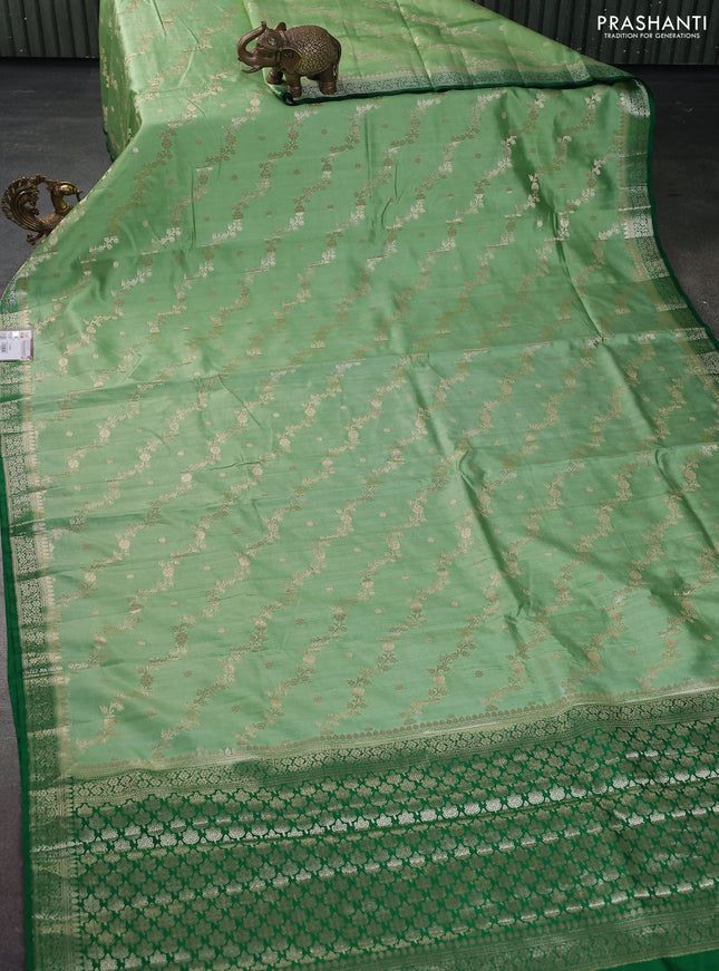 Chiniya silk saree pista green and green with allover zari weaves and zari woven border