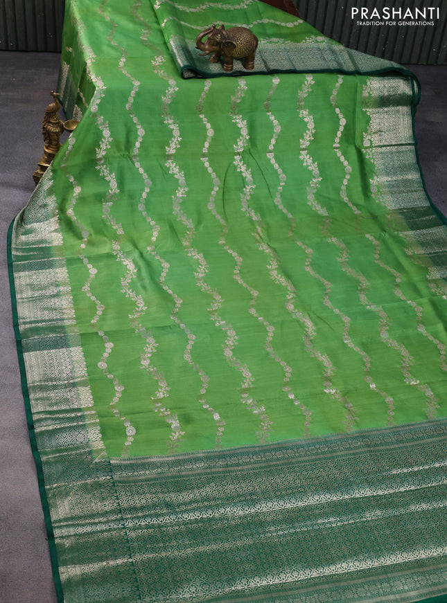Chiniya silk saree light green and dark green with allover zari weaves and zari woven border