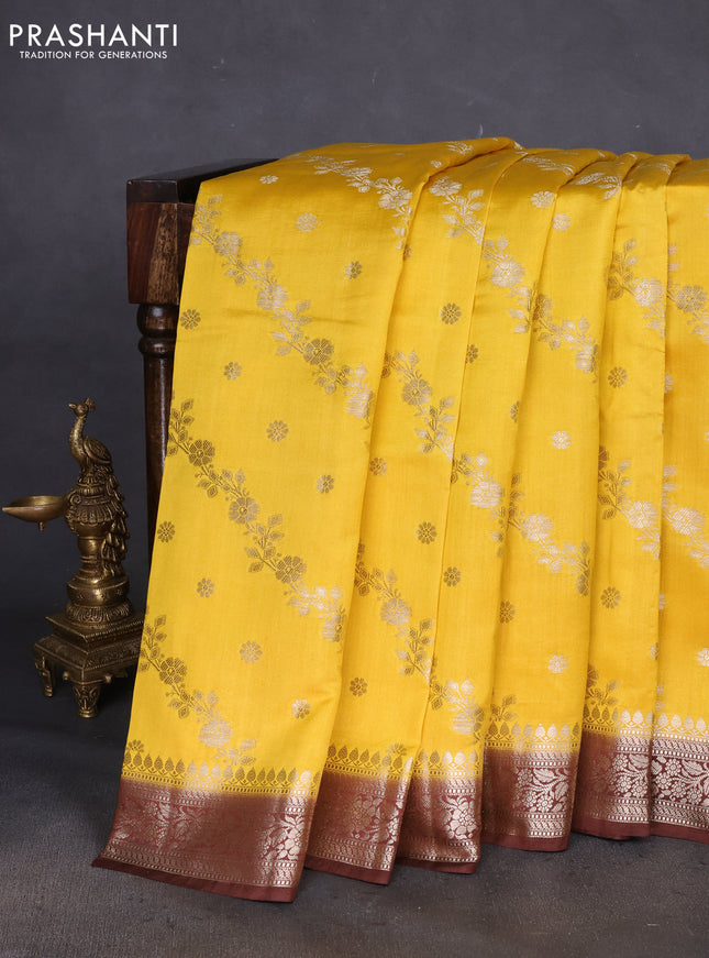 Chiniya silk saree yellow and coffee brown with allover zari weaves and zari woven border
