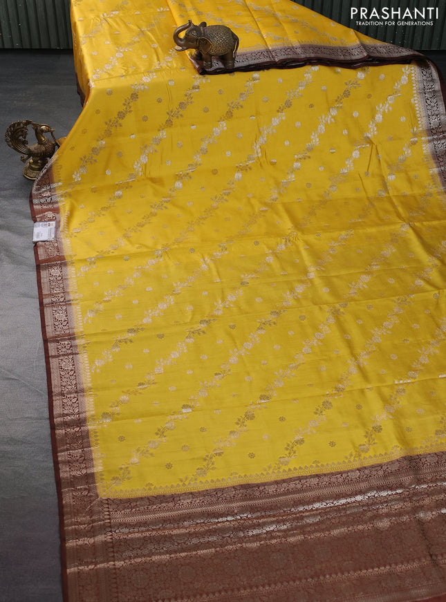 Chiniya silk saree yellow and coffee brown with allover zari weaves and zari woven border
