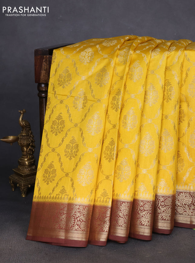 Chiniya silk saree yellow and coffee brown with allover zari weaves and zari woven border