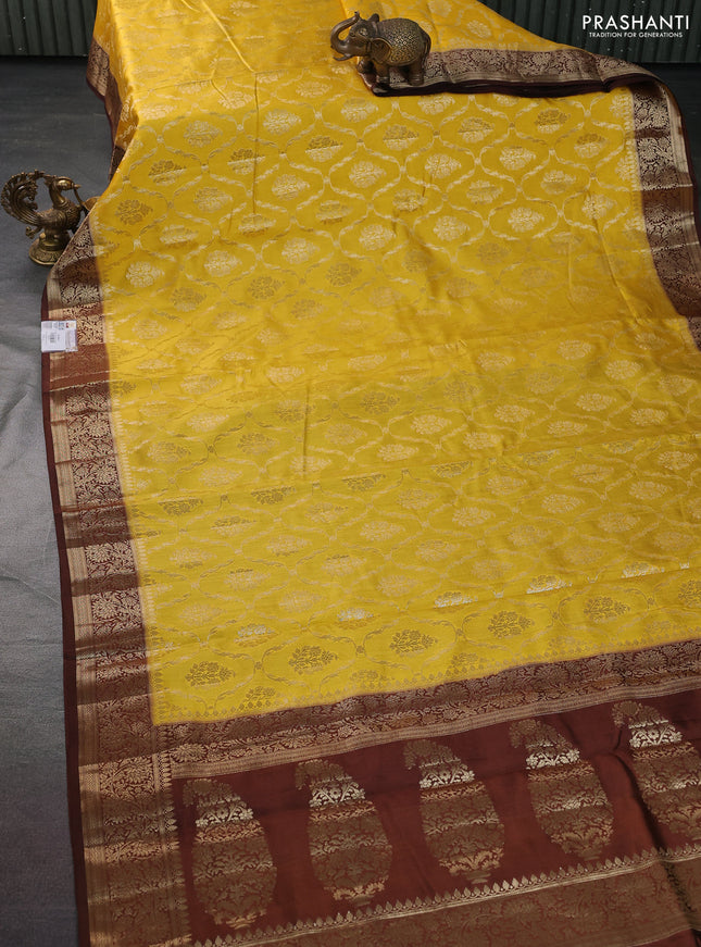 Chiniya silk saree yellow and coffee brown with allover zari weaves and zari woven border