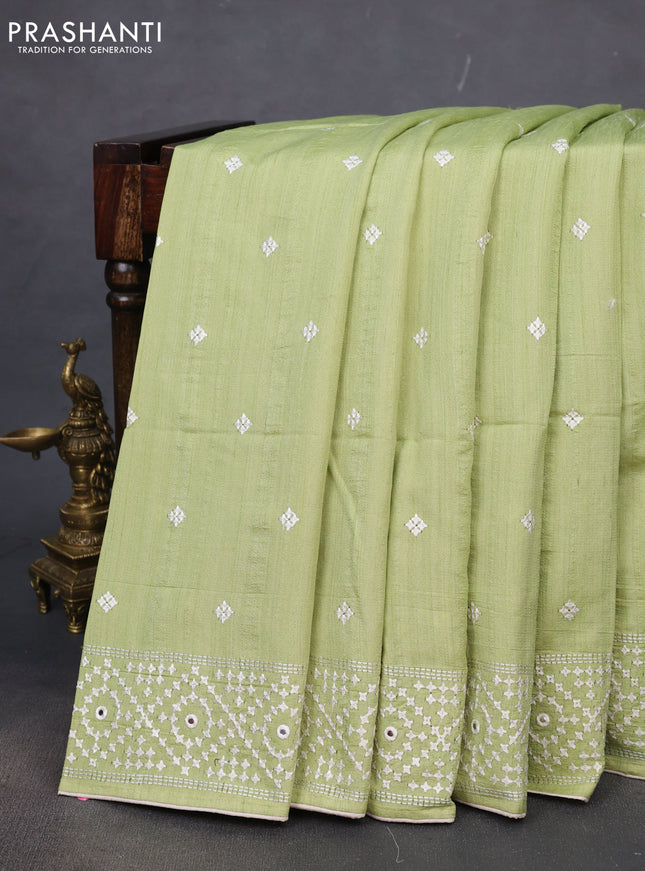 Semi tussar saree pista green and cream with embroidery work buttas and embroidery mirror work border