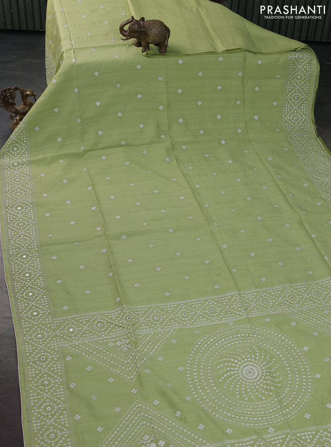 Semi tussar saree pista green and cream with embroidery work buttas and embroidery mirror work border