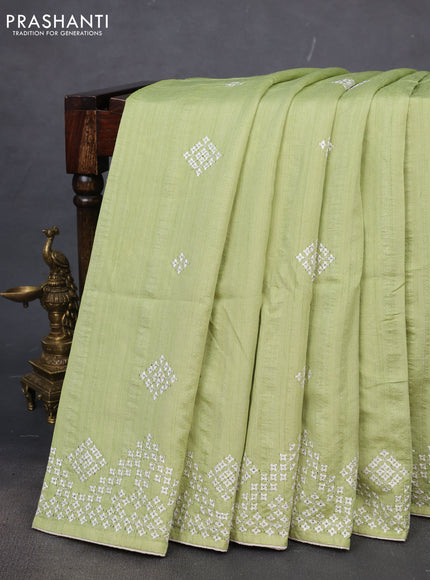 Semi tussar saree pista green and cream with embroidery work buttas and embroidery mirror work border