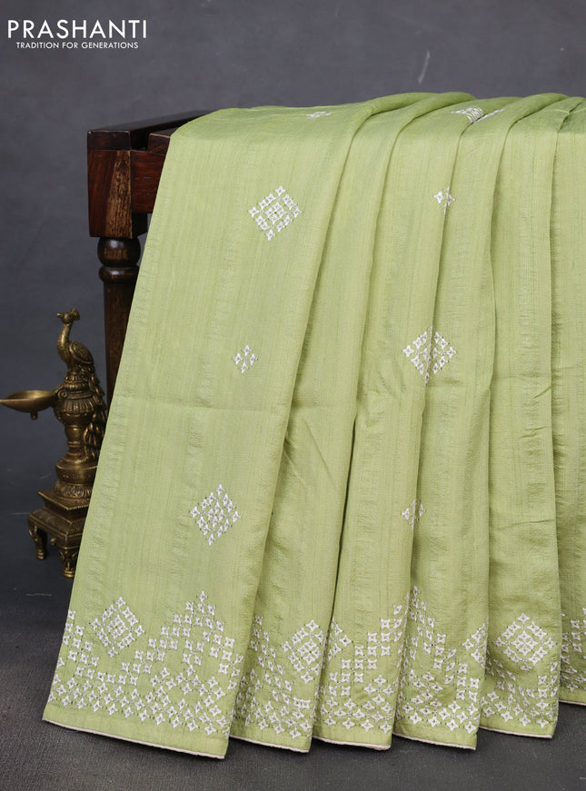 Semi tussar saree pista green and cream with embroidery work buttas and embroidery mirror work border