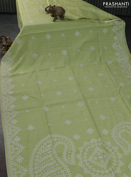 Semi tussar saree pista green and cream with embroidery work buttas and embroidery mirror work border