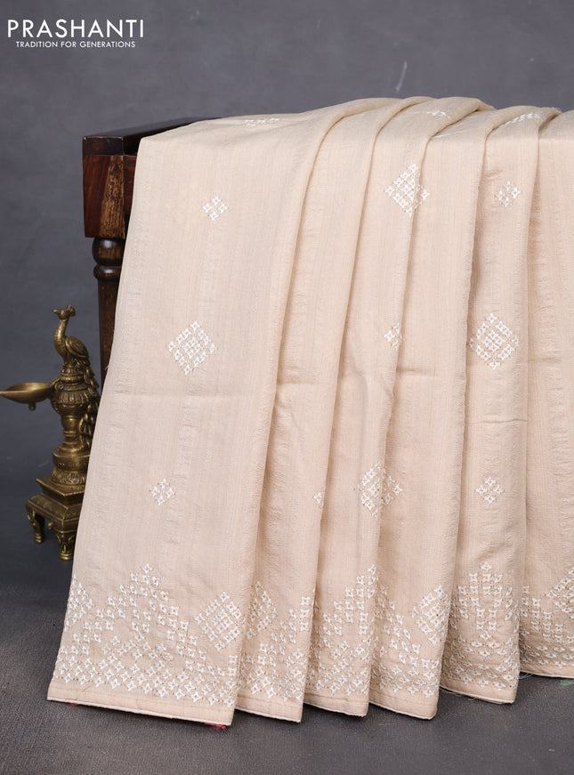 Semi tussar saree cream with embroidery work buttas and embroidery mirror work border