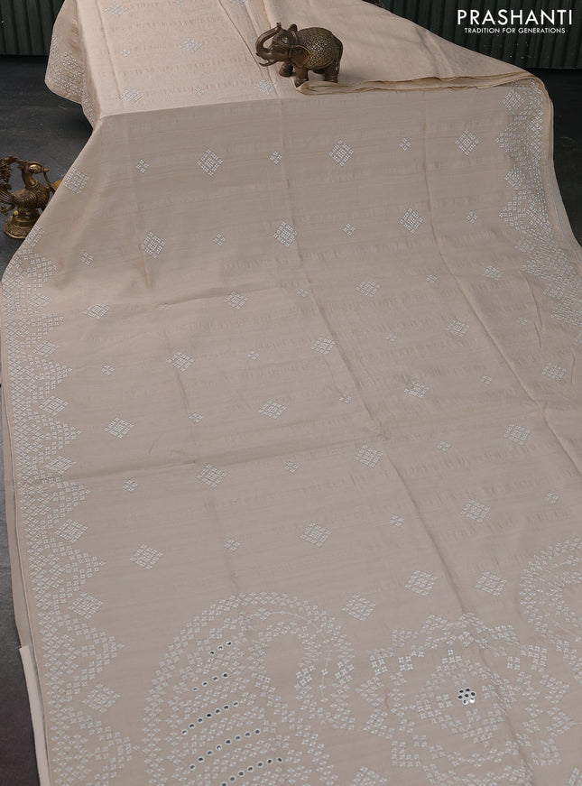Semi tussar saree cream with embroidery work buttas and embroidery mirror work border