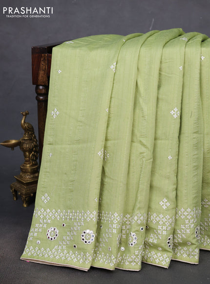 Semi tussar saree pista green and cream with embroidery work buttas and embroidery mirror work border