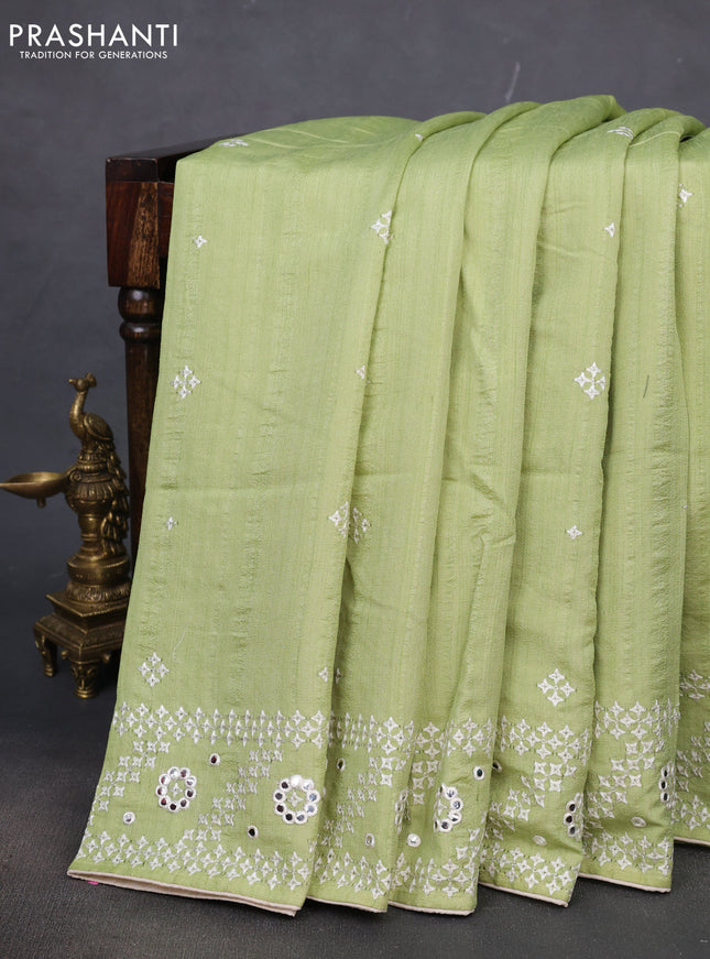 Semi tussar saree pista green and cream with embroidery work buttas and embroidery mirror work border