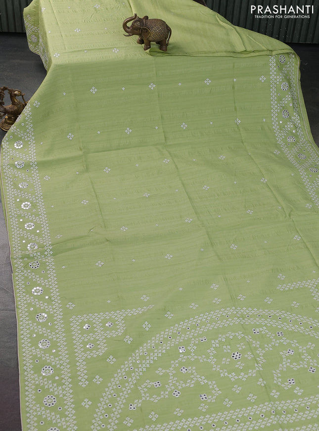 Semi tussar saree pista green and cream with embroidery work buttas and embroidery mirror work border