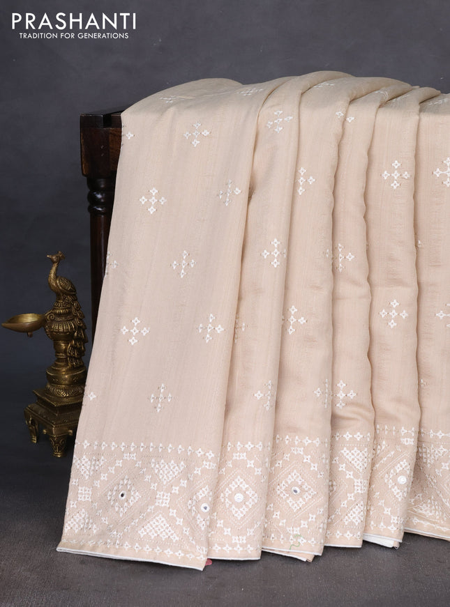 Semi tussar saree beige and cream with embroidery work buttas and embroidery mirror work border