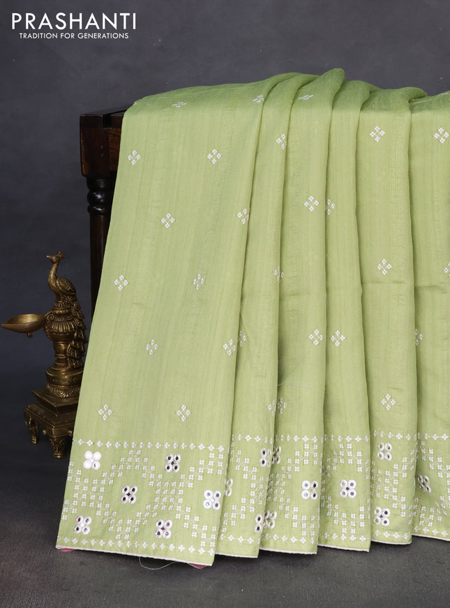 Semi tussar saree pista green and cream with embroidery work buttas and embroidery mirror work border