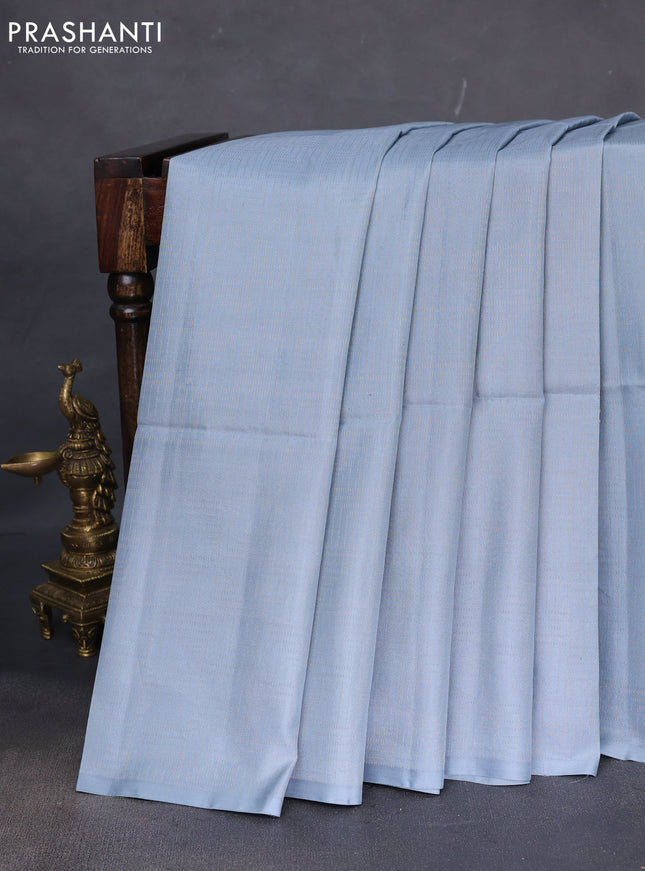 Kanchipuram soft silk saree pastel blue and dual shade of pinkish orange with allover zari weaves in borderless style