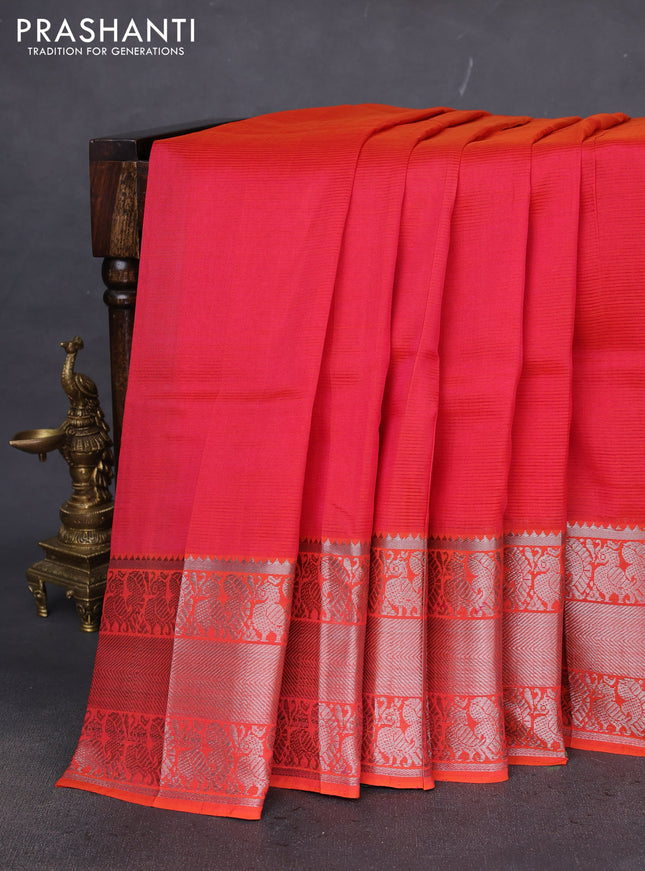 Mangalgiri silk cotton saree dual shade of reddish orange with plain body and silver zari woven border