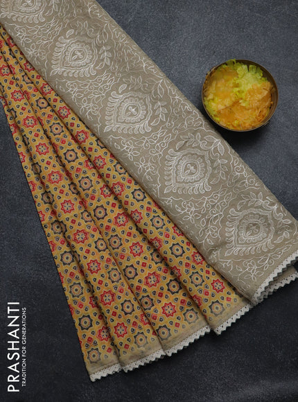 Semi chanderi saree yellow and beige with allover ajrakh prints and embroidery pallu