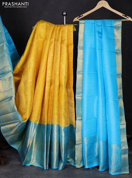 Pure kanchipuram silk lehenga yellow and teal blue with allover zari woven brocade weaves and long rich zari woven border