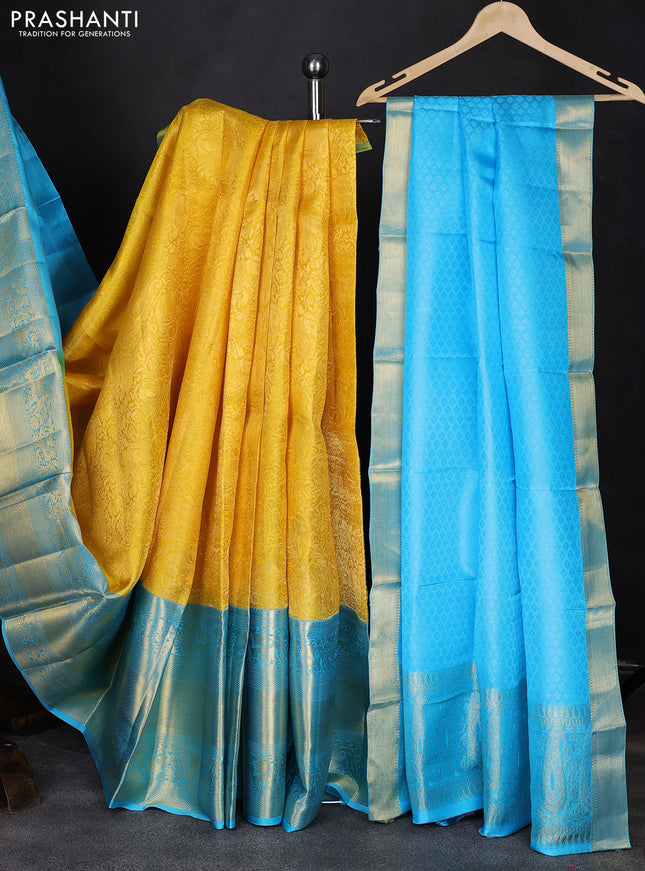 Pure kanchipuram silk lehenga yellow and teal blue with allover zari woven brocade weaves and long rich zari woven border