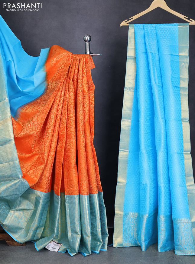 Pure kanchipuram silk lehenga orange and light blue with allover zari woven brocade weaves and long zari woven border