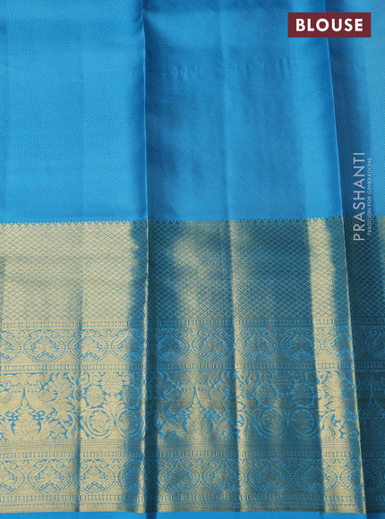 Pure kanchipuram silk lehenga orange and light blue with allover zari woven brocade weaves and long zari woven border