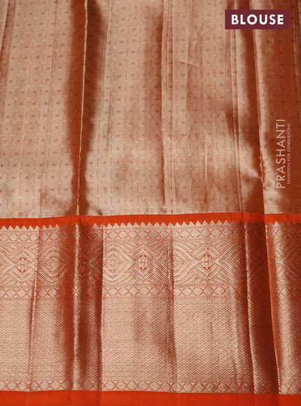 Pure kanchipuram tissue silk lehenga beige and orange with allover zari woven floral brocade weaves and long zari woven border