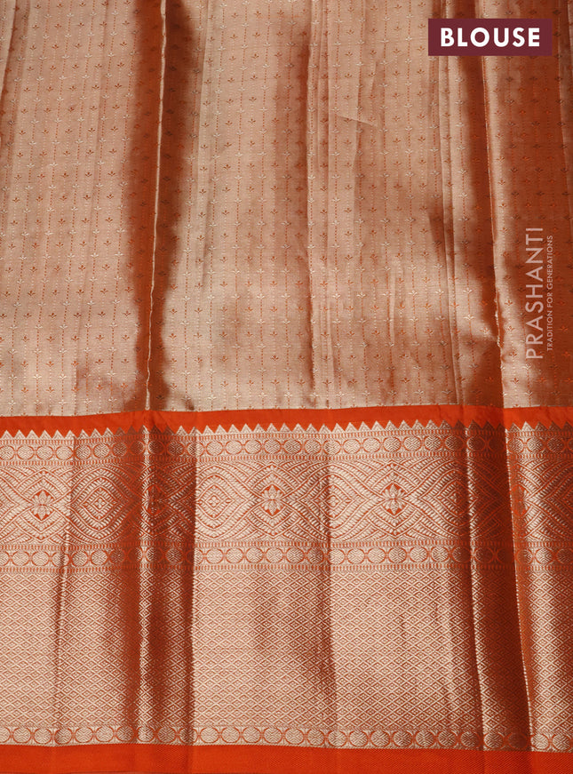 Pure kanchipuram tissue silk lehenga beige and orange with allover zari woven floral brocade weaves and long zari woven border