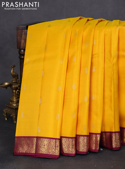 Pure kanchipuram silk saree yellow and wine shade with zari woven buttas and zari woven korvai border