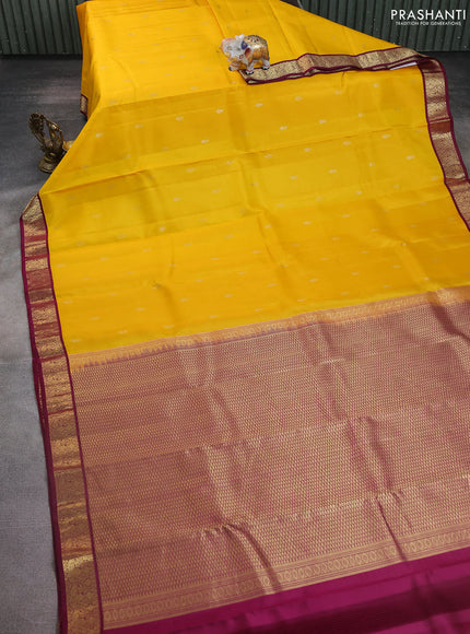 Pure kanchipuram silk saree yellow and wine shade with zari woven buttas and zari woven korvai border