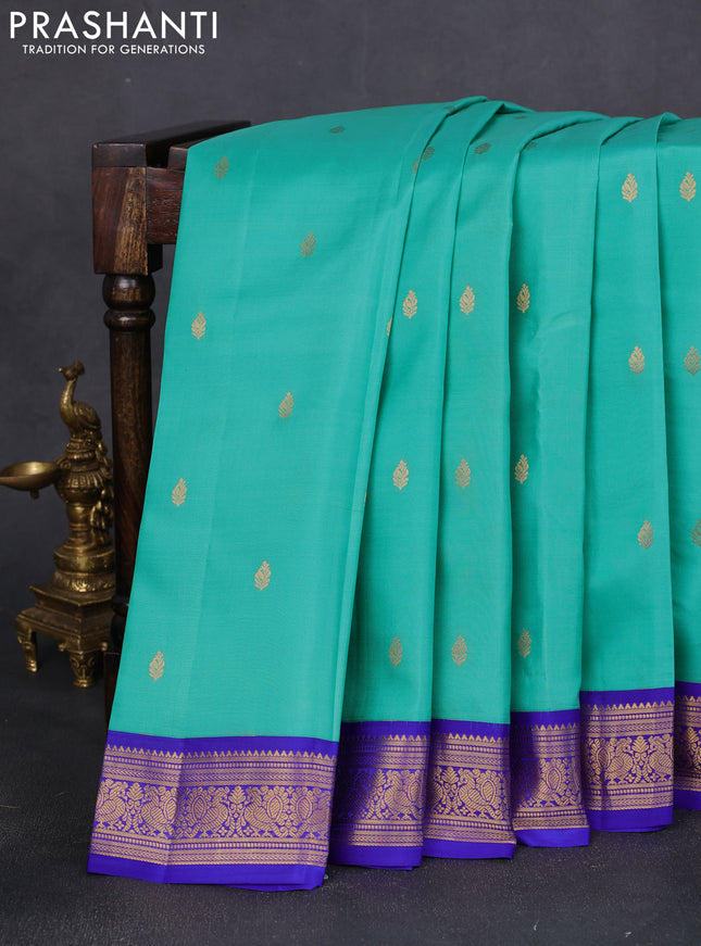 Pure kanchipuram silk saree teal green and blue with zari woven buttas and annam zari woven border