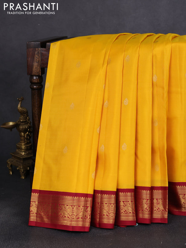 Pure kanchipuram silk saree yellow and maroon with zari woven buttas and annam zari woven korvai border