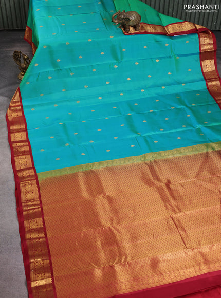 Pure kanchipuram silk saree dual shade of teal green and maroon with zari woven buttas and annam zari woven korvai border