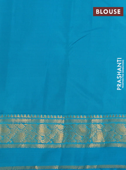 Pure kanchipuram silk saree dual shade of pink and teal blue  with allover zari woven buttas and rettapet zari woven korvai border