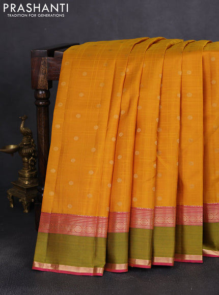 Pure kanchipuram silk saree mustard yellow and pink with allover self emboss & zari buttas and rettapet zari woven korvai border