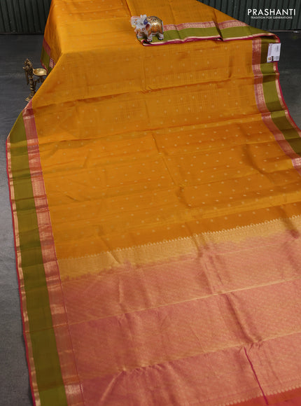 Pure kanchipuram silk saree mustard yellow and pink with allover self emboss & zari buttas and rettapet zari woven korvai border