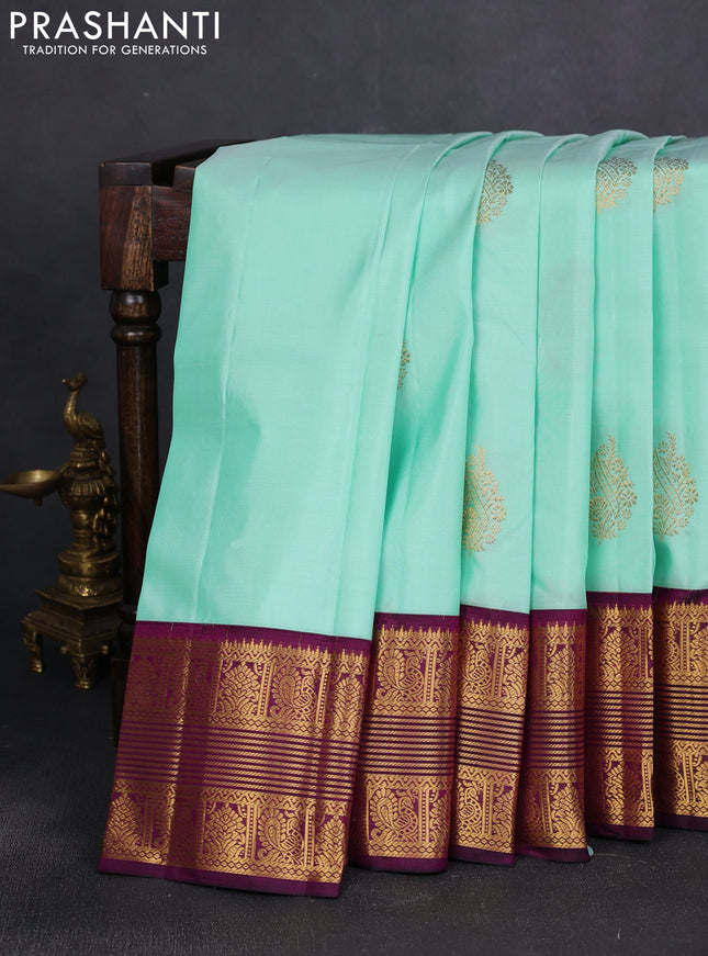 Pure kanchipuram silk saree teal shade and wine shade with zari woven buttas and rich zari woven border
