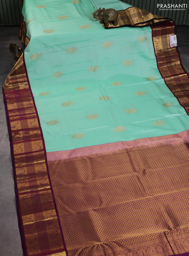 Pure kanchipuram silk saree teal shade and wine shade with zari woven buttas and rich zari woven border