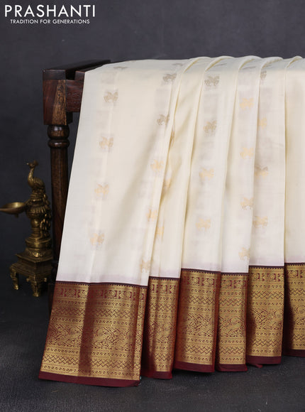 Pure kanchipuram silk saree cream and deep maroon with zari woven buttas and rich zari woven border