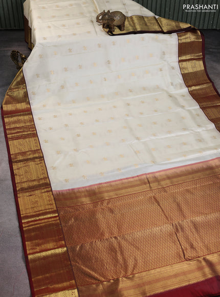 Pure kanchipuram silk saree cream and deep maroon with zari woven buttas and rich zari woven border