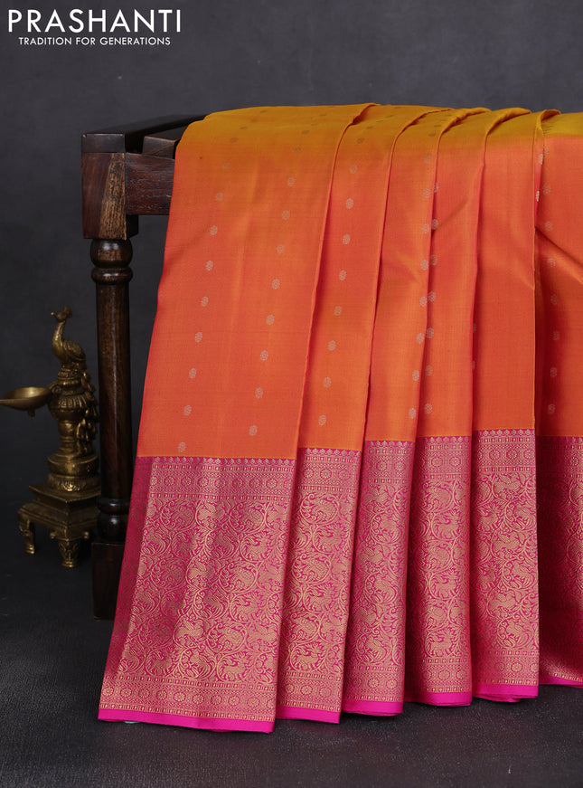 Pure kanchipuram silk saree dual shade of mustard yellow and pink with allover zari woven buttas and long rich zari woven border