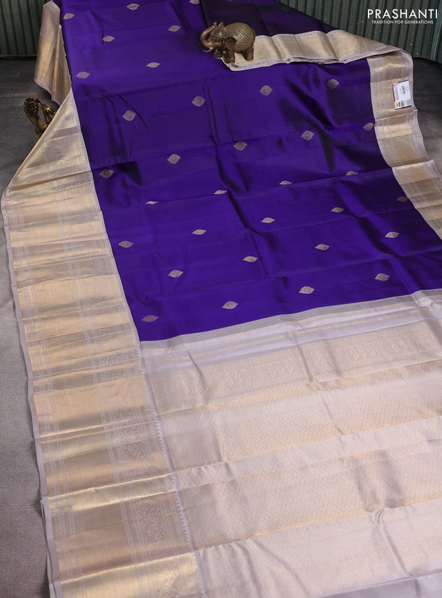 Pure kanchipuram silk saree blue and pastel grey with zari woven buttas and long rich zari woven korvai border