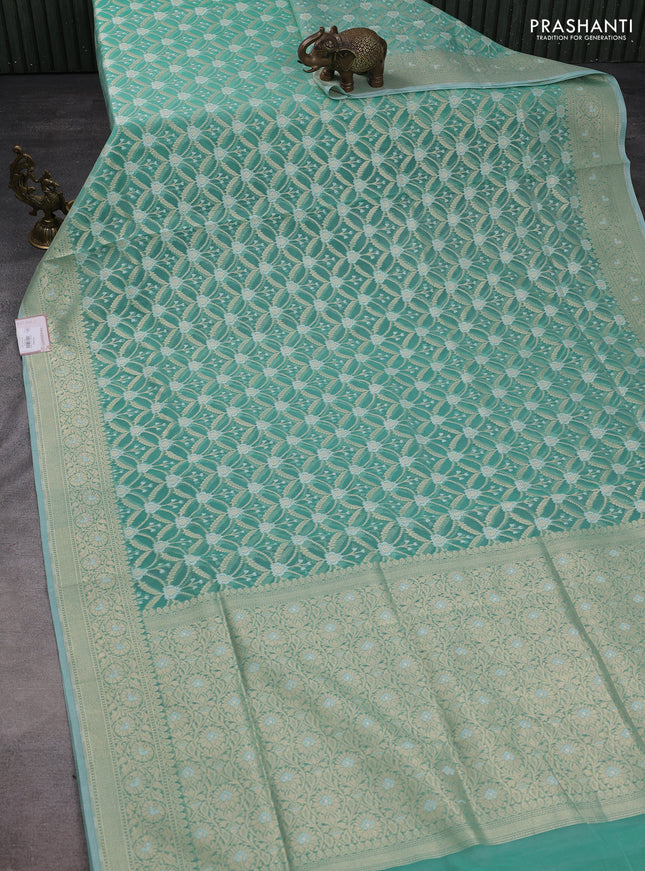 Banarasi silk cotton saree teal shade with allover zari weaves and zari woven border