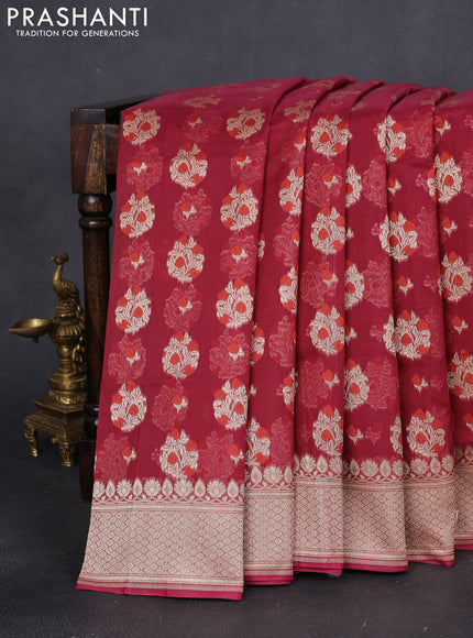 Banarasi silk cotton saree maroon with allover floral zari woven buttas and zari woven border