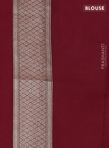 Banarasi silk cotton saree maroon with allover floral zari woven buttas and zari woven border