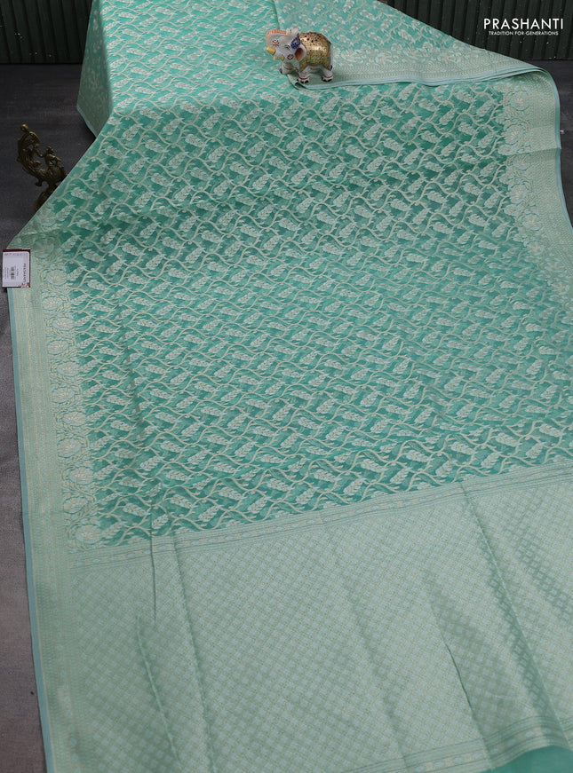 Banarasi silk cotton saree teal green with allover zari weaves and thread & zari woven border