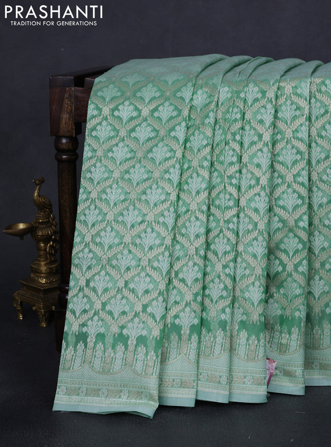 Banarasi silk cotton saree teal green with allover zari weaves and zari woven border