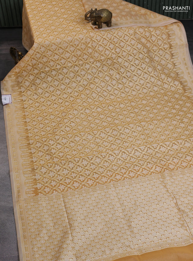 Banarasi silk cotton saree sandal with allover zari weaves and zari woven border