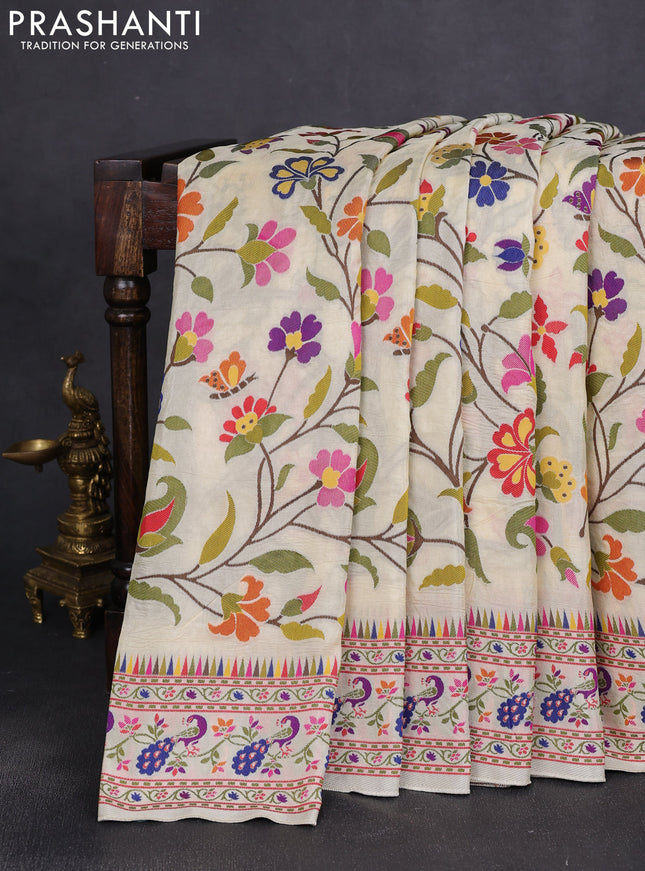 Dola silk saree cream with allover jamdhani thread weaves and peacock design thread woven border